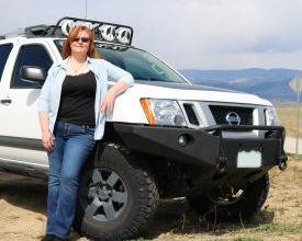 Wendy Miles next to her 2013 Nissan Xterra