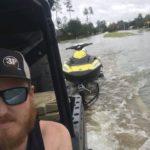 Josh Herzing showcases a jet ski in tow during a recue mission