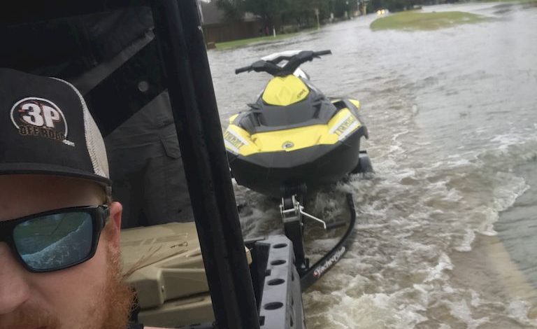 Josh Herzing showcases a jet ski in tow during a recue mission