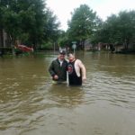 Josh Herzing (right) and another volunteer take a buddy shot while on a day-long mission near Houston