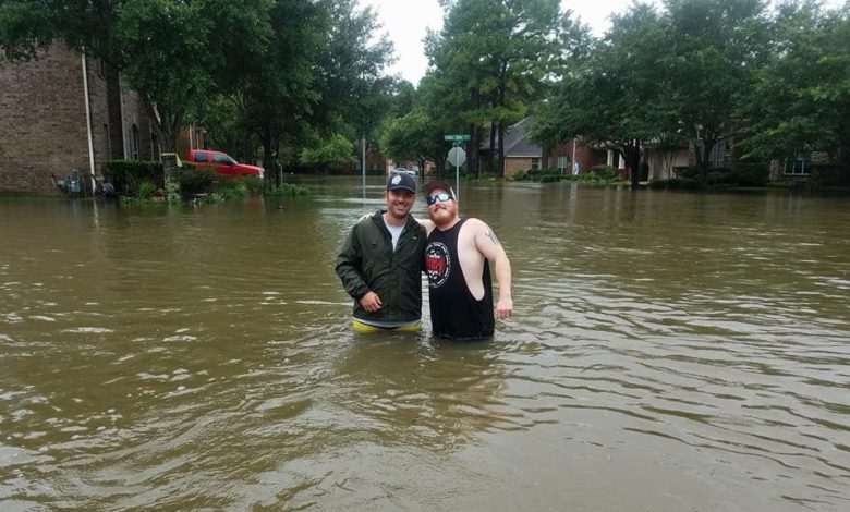 Josh Herzing (right) and another volunteer take a buddy shot while on a day-long mission near Houston