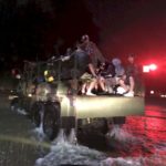 Volunteers in the 3P Offroad 5-ton military vehicle on a rescue mission