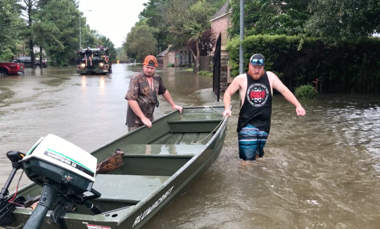 Josh Herzing (right) and another volunteer during rescue efforts near Houston