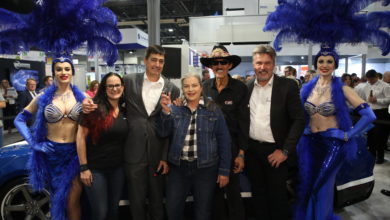 Pictured with two Las Vegas showgirls beside the MAHLE Drive With The Original Technician promotion grand prize MAHLE Mustang bu