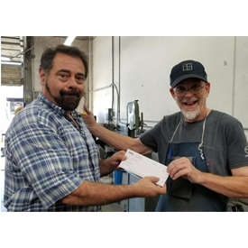 Jack Burns (right) and his business partner, Rick Popovits, have passed Burns Stainless ownership to Vince Roman (left), a longt
