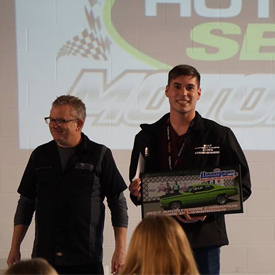 Sportsman champion, Chris Dovenbarger, proudly accepting his official championâ€™s jacket, plaque and prize money from Pacemakers 