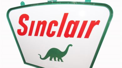 Near-flawless 1959 Sinclair Oil double-sided porcelain service station sign with Dino logo (Lot #8210)â€”one of the nicest example