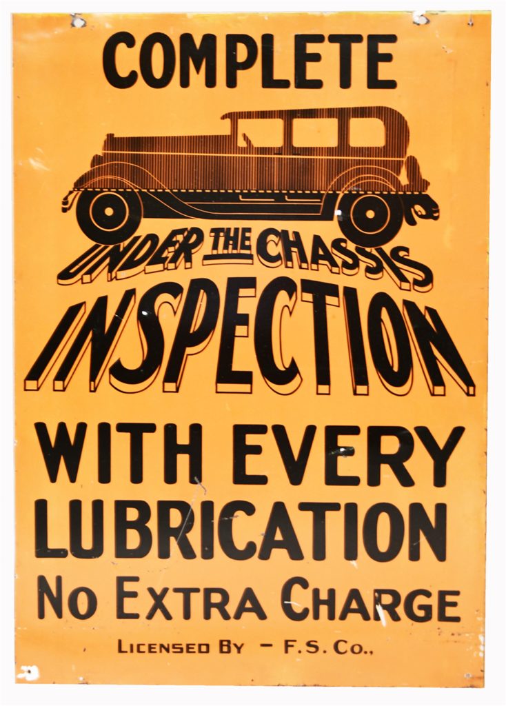1920's Under the Chassis Inspection double-sided tin automotive garage sign with period sedan logo (Lot #7225).