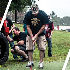 A contestant putts Road Armorâ€™s "Hole in One Challenge"