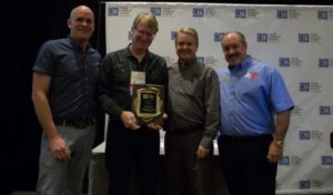 Trent Lowe accepts his Pioneer Award from CAN on Oct. 31 in Las Vegas