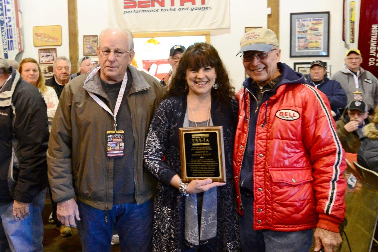 Donna Garlits, center, was presented with an award by Bruce Larson, right, and Dick Gerwer, left.