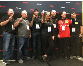 Team Elite Motorsports poses following a press conference at the Dec. 6-8 PRI Show in Indianapolis