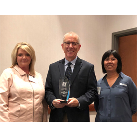 Melling Engine Parts won Engine Pro's Good Stewardship Award. Left to right: Laura Short, Melling Engine Parts; William E. Cook,