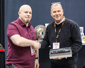 A StopTech representative accepted the Supplier of the Year Award from Turn 14 Distribution at the Dec. 6-8 PRI Show in Indianap