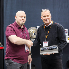 A StopTech representative accepted the Supplier of the Year Award from Turn 14 Distribution at the Dec. 6-8 PRI Show in Indianap