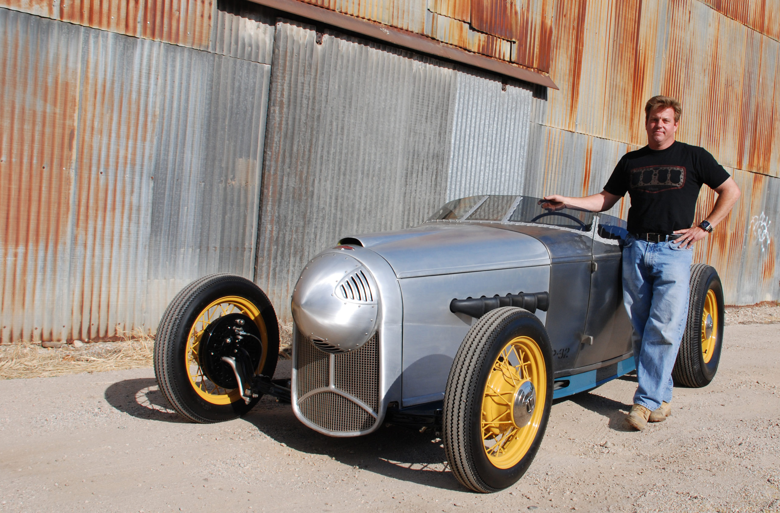 Chip Foose poses with the WWII fighter plane-inspired 1932 Ford Roadster, nicknamed P-32