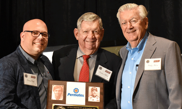 Donny Braga (left),Â Permatex senior marketing manager, accepts the Allison Family Corporate Award from Donnie Allison (center) a