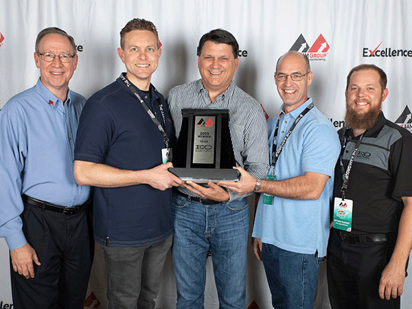 The Earl Owen Co. team joins with The AAM Group team for a quick snapshot after winning the 2019 Member of the Year award at the