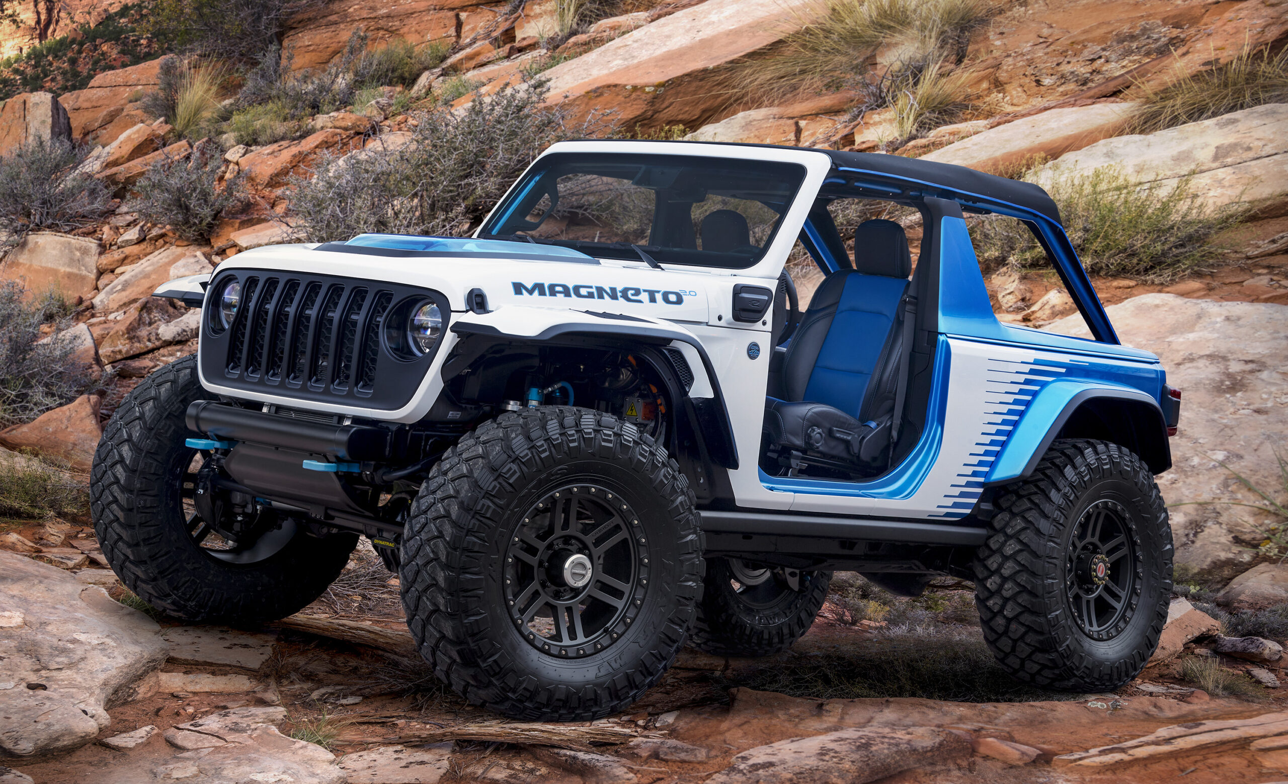 Blue and white jeep in desert