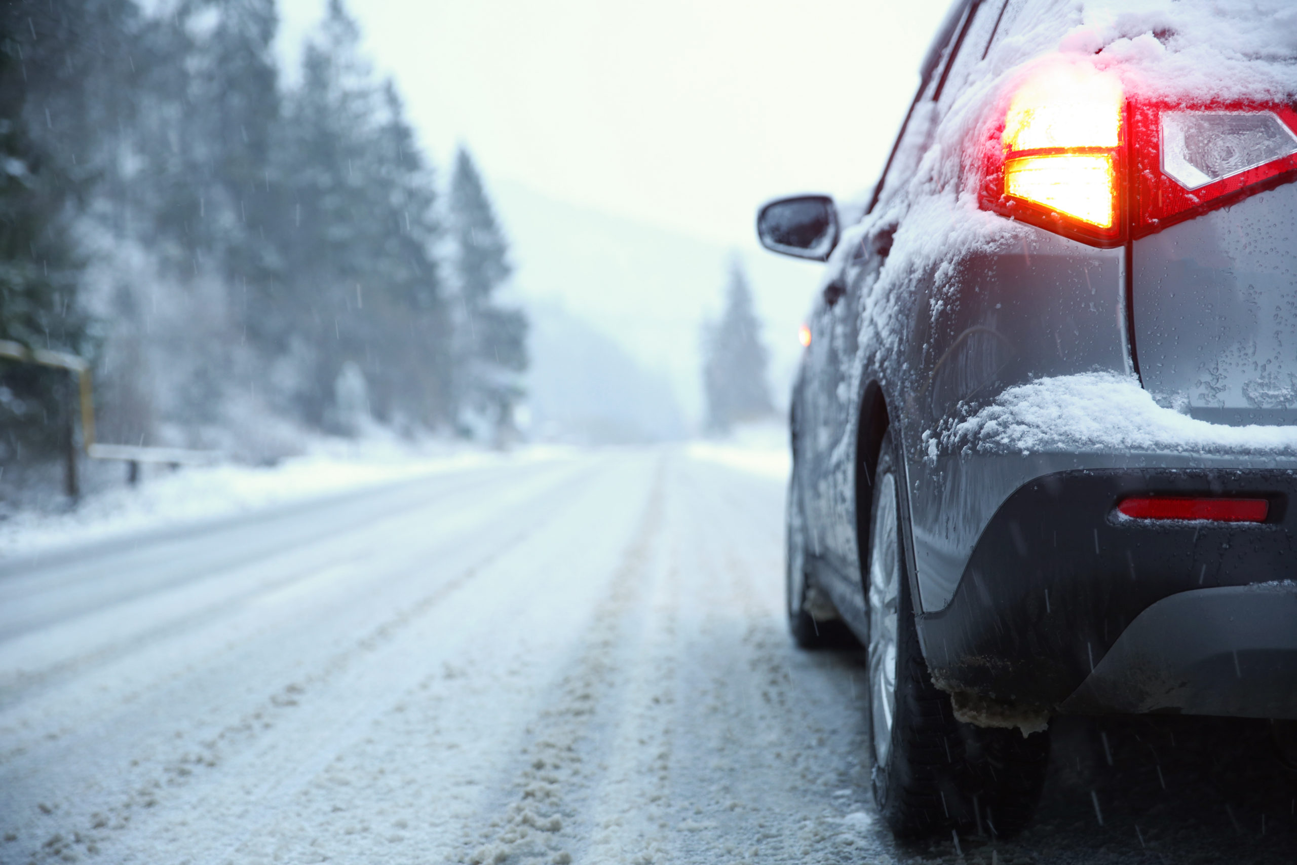 Car on country road in winter day