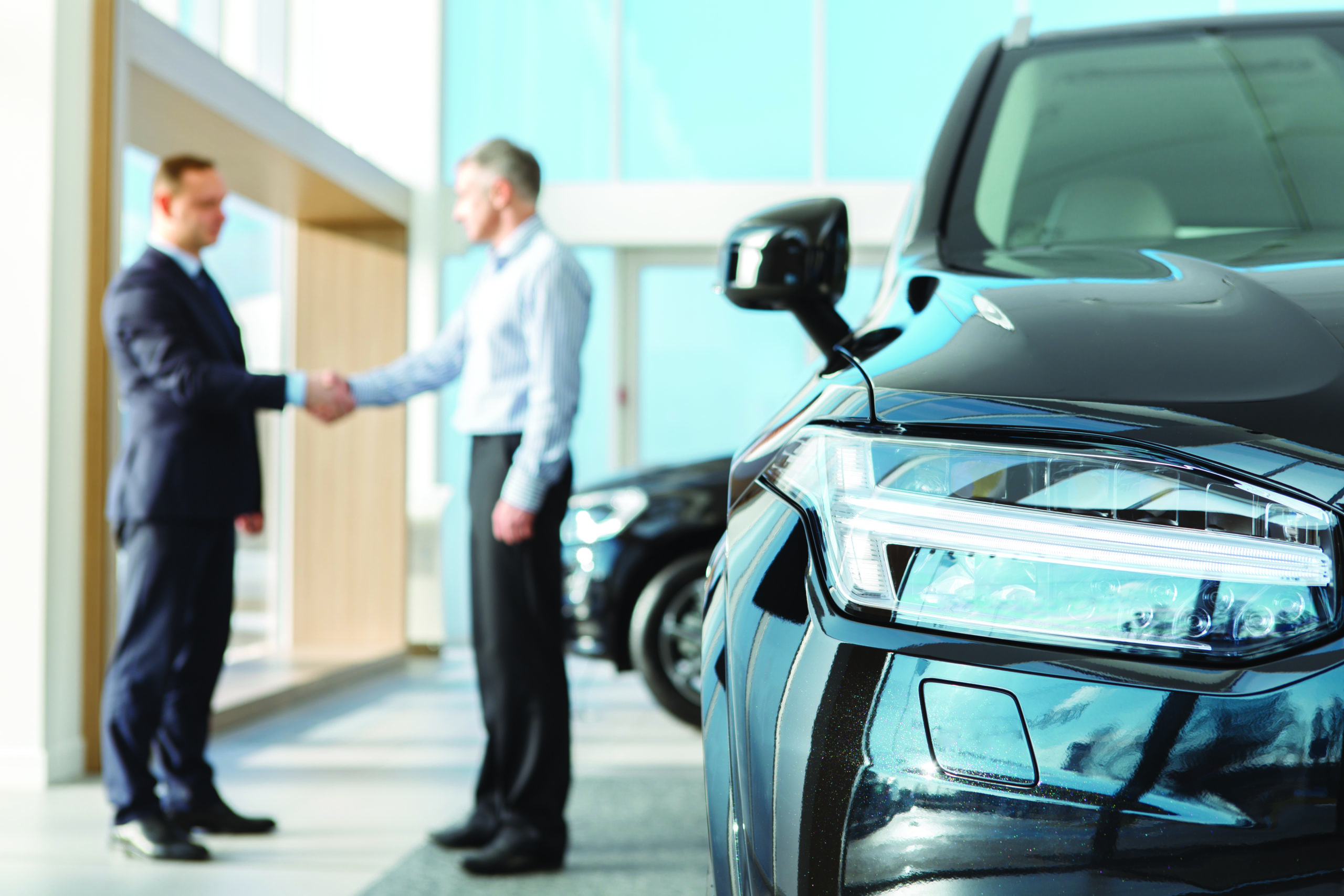 Deal closed. Selective focus on a car businessman shaking hands with car dealer after buying a new car copyspace deal contract agreement car dealership customer client service sales vehicle insurance