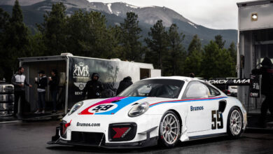Brumos Porsche race car rolling out of trailer at Pikes Peak