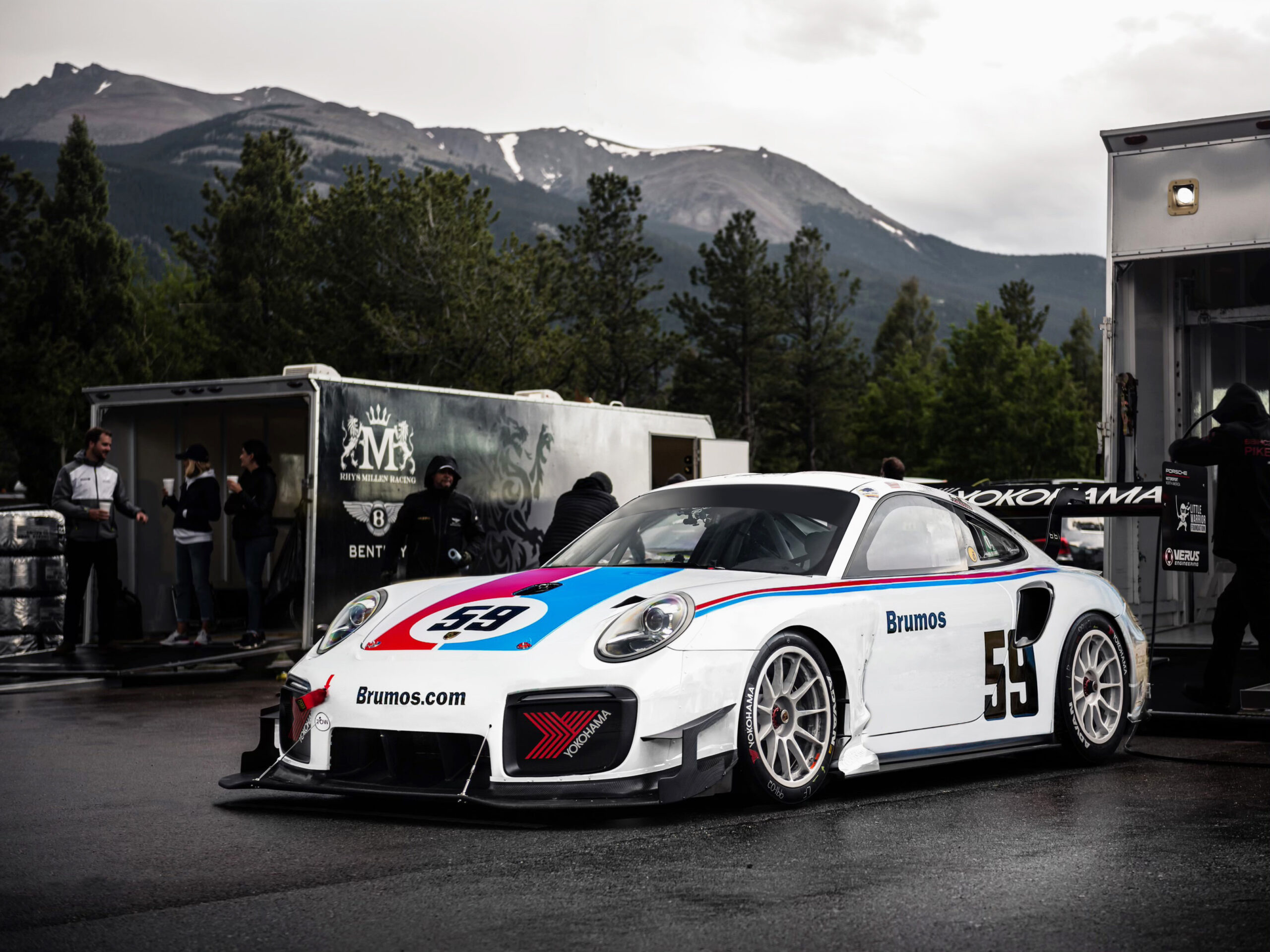 Brumos Porsche race car rolling out of trailer at Pikes Peak