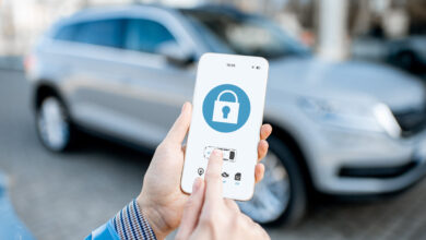 Locking car using mobile application on a smart phone. Concept of remote control and car protection through the internet