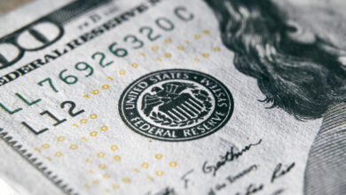 federal reserve mark on a 100 dollar bill