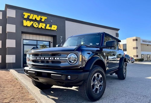 Ford Bronco parked outside an auto shop