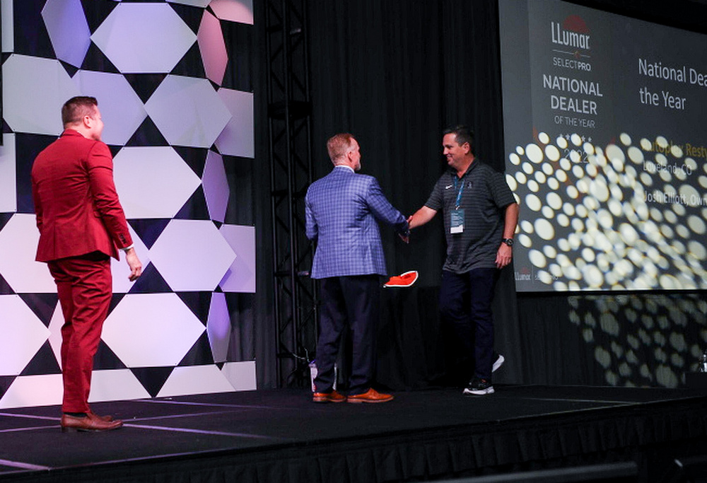 Josh Elliott receives his LLumar Dealer of the Year award