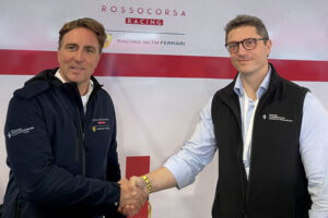 Andrea Zadra, left, CEO of Rossocorsa Racing and Dilawri Rossocorsa’s inaugural team lead, shakes hands with Ettore Gattolin, Dilawri’s vice president of U.S. operations