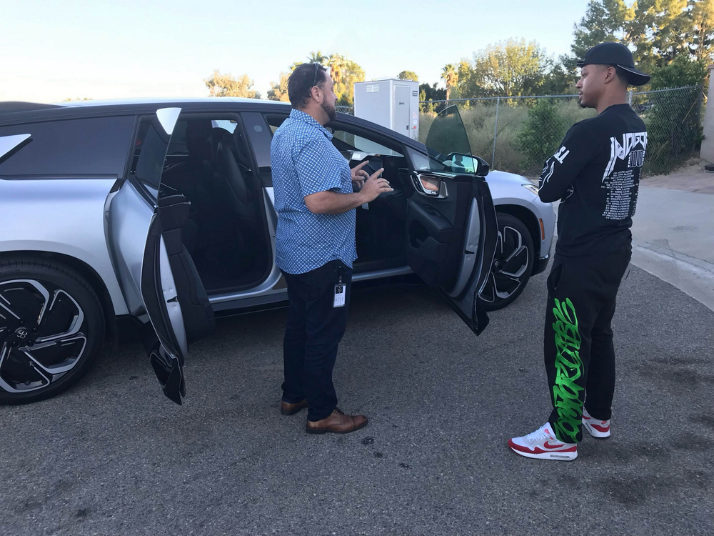 Chris Brown checks out Faraday vehicle