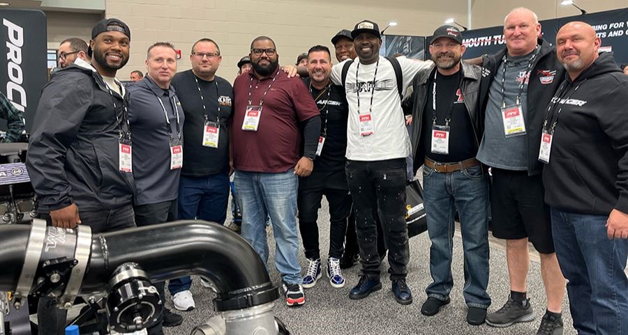 ProCharger-backed racers pose in trade show booth