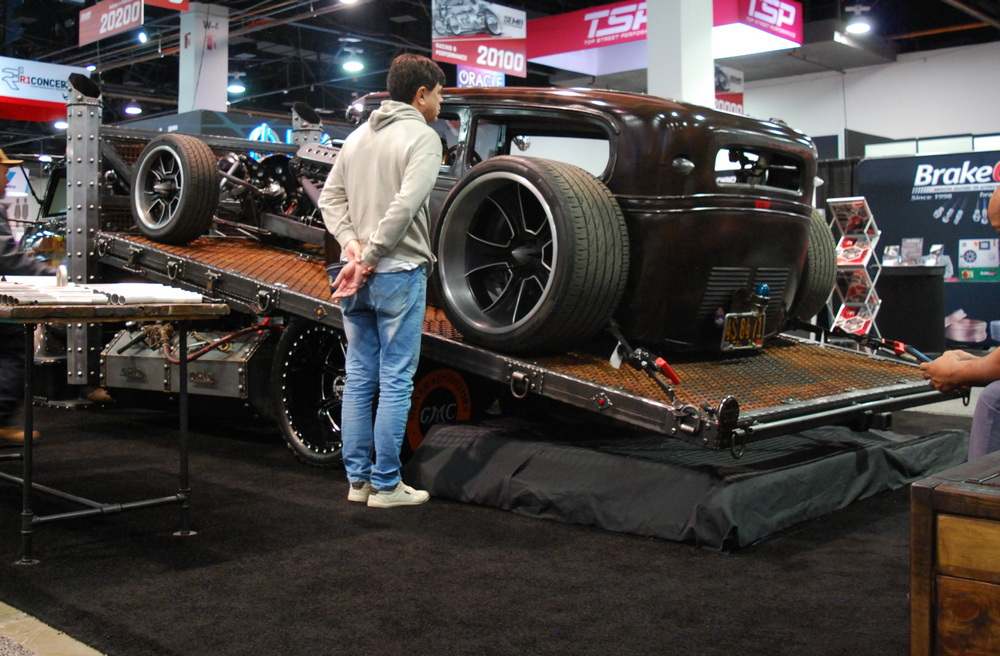SEMA Show attendee looks at custom carried on a flatbead