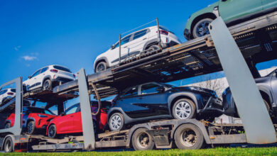 Vehicles loaded on 2-deck car transport trailer