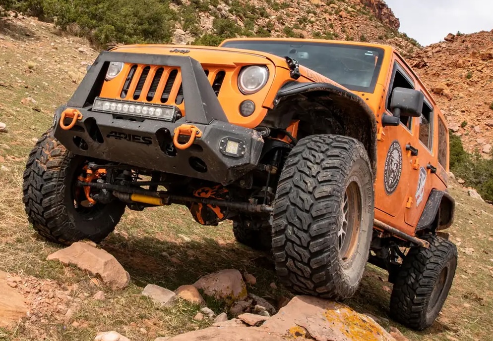 Aries front bumper on orange Jeep