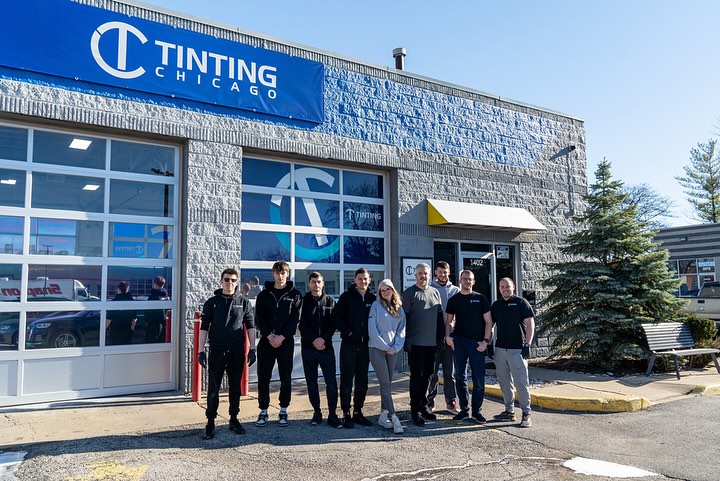 TC team photo in front of storefront