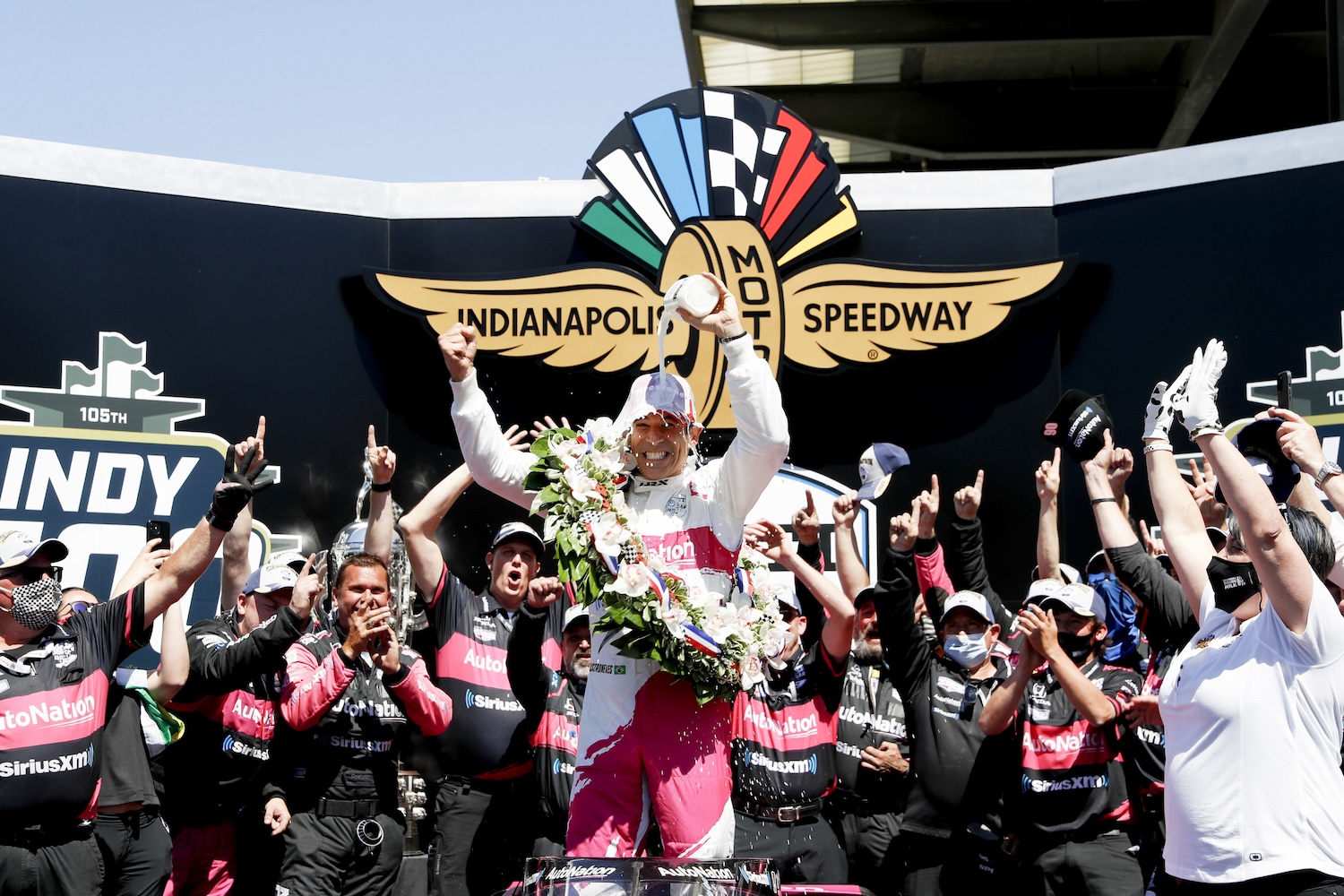 Hélio Castroneves celebrates winning the Indy 500