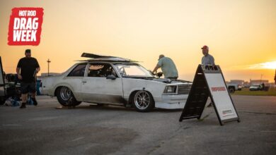 Racers working on car for HOT ROD Drag Week