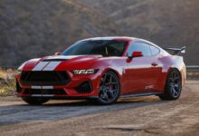 Red Shelby GT350 parked on road