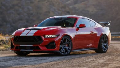 Red Shelby GT350 parked on road