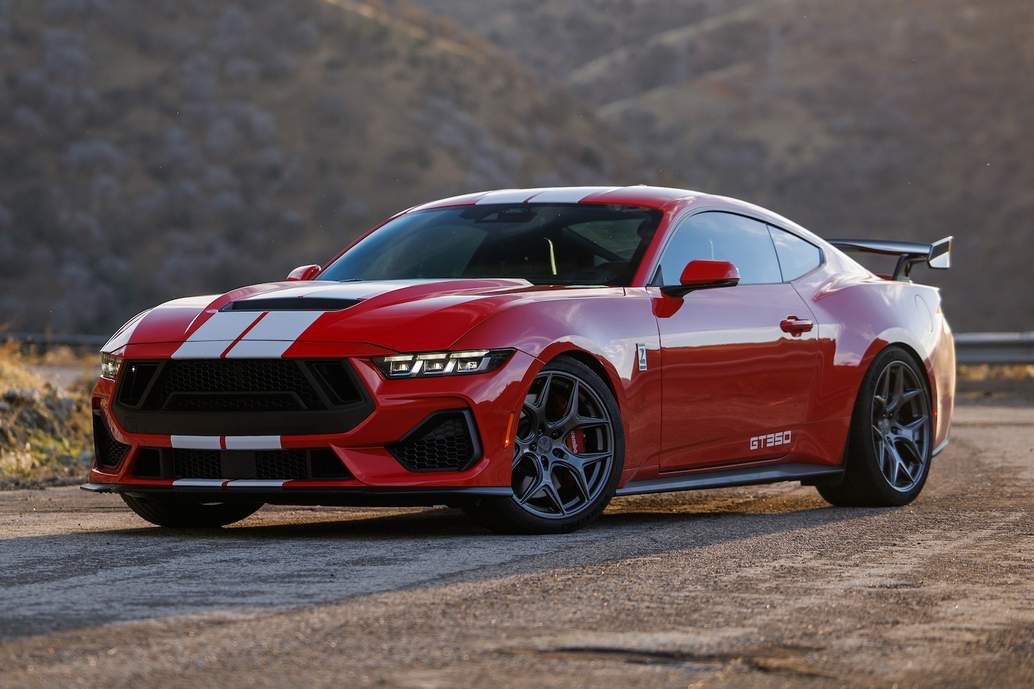 Red Shelby GT350 parked on road