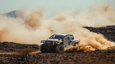 Truck racing in desert at Dakar Rally