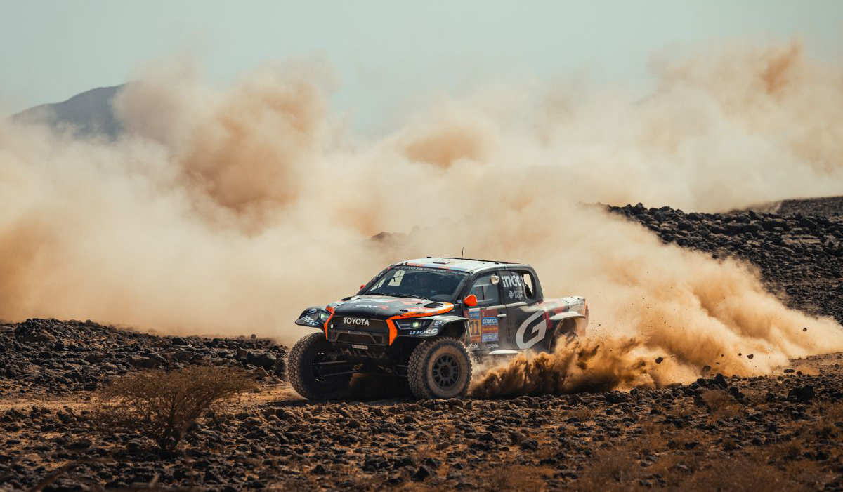 Truck racing in desert at Dakar Rally