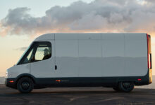 Side view of the Rivian Commercial Van parked in front of sunset