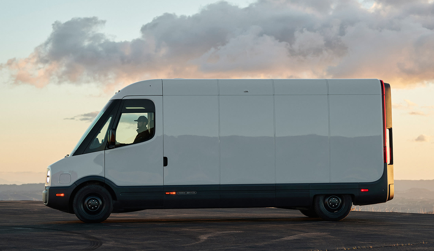 Side view of the Rivian Commercial Van parked in front of sunset