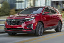 Front 3/4 view of 2024 Chevrolet Equinox RS in Radiant Red Tintcoat