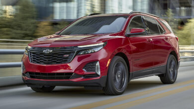 Front 3/4 view of 2024 Chevrolet Equinox RS in Radiant Red Tintcoat