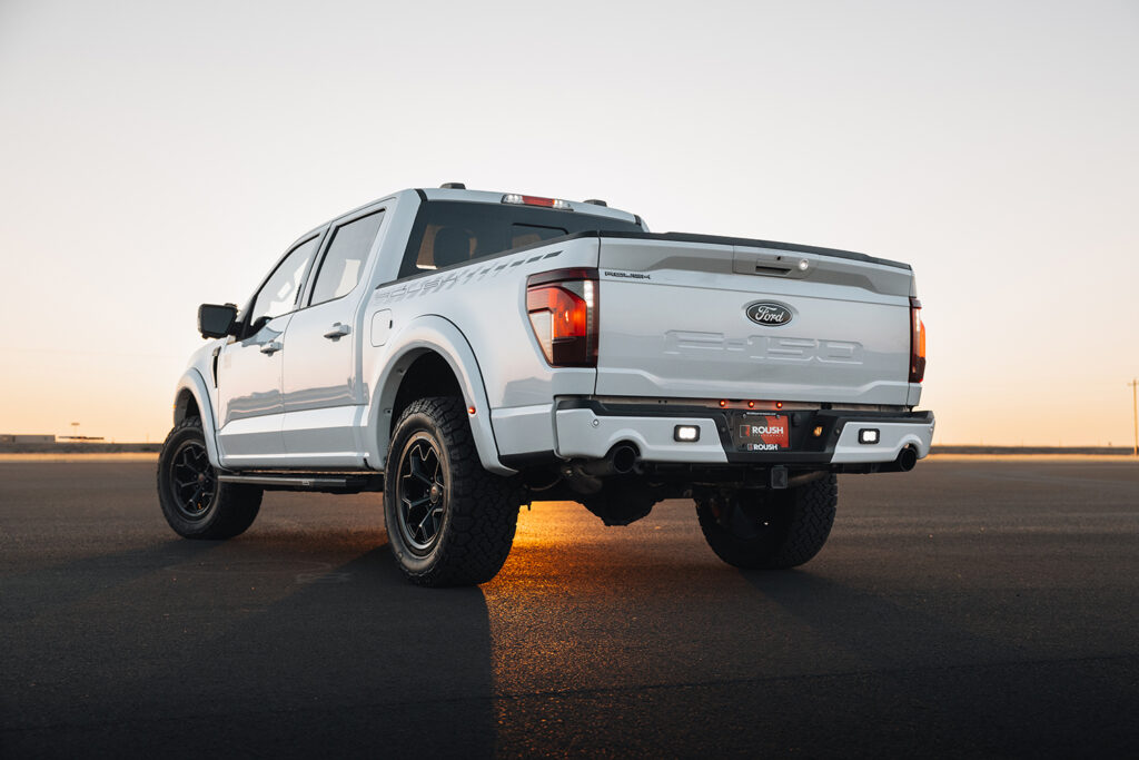 Rear of Roush Performance Ford F-150 parked in front of sunset